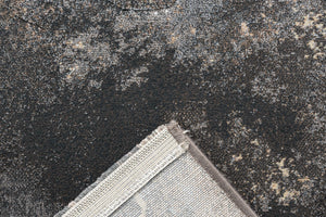 Folded corner showing the woven backing of the Tapison Home Torino 063.0934.3293 grey rug