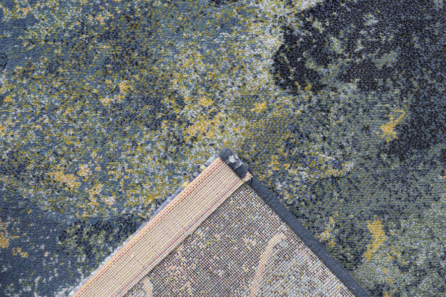 Folded corner showing the woven backing of the Tapison Home Torino 063.0934.5241 blue rug