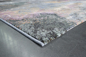 Corner detail of the Tapison Home Torino 063.0934.5626 rug in soft pink, ochre, sage and grey blue