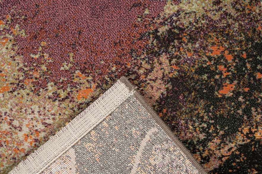 Folded corner showing the woven backing of the Tapison Home Torino 063.0934.7274 purple rug