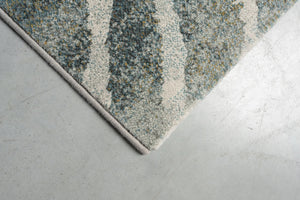 Corner detail of the Tapison Home Torino 063.0990.4299 rug in green and grey