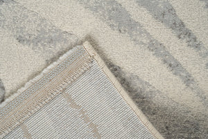 Folded corner showing the woven backing of the Tapison Home Torino 063.0990.6797 ivory rug