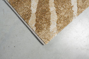 Corner detail of the Tapison Home Torino 063.0990.7299 rug in ochre and ivory