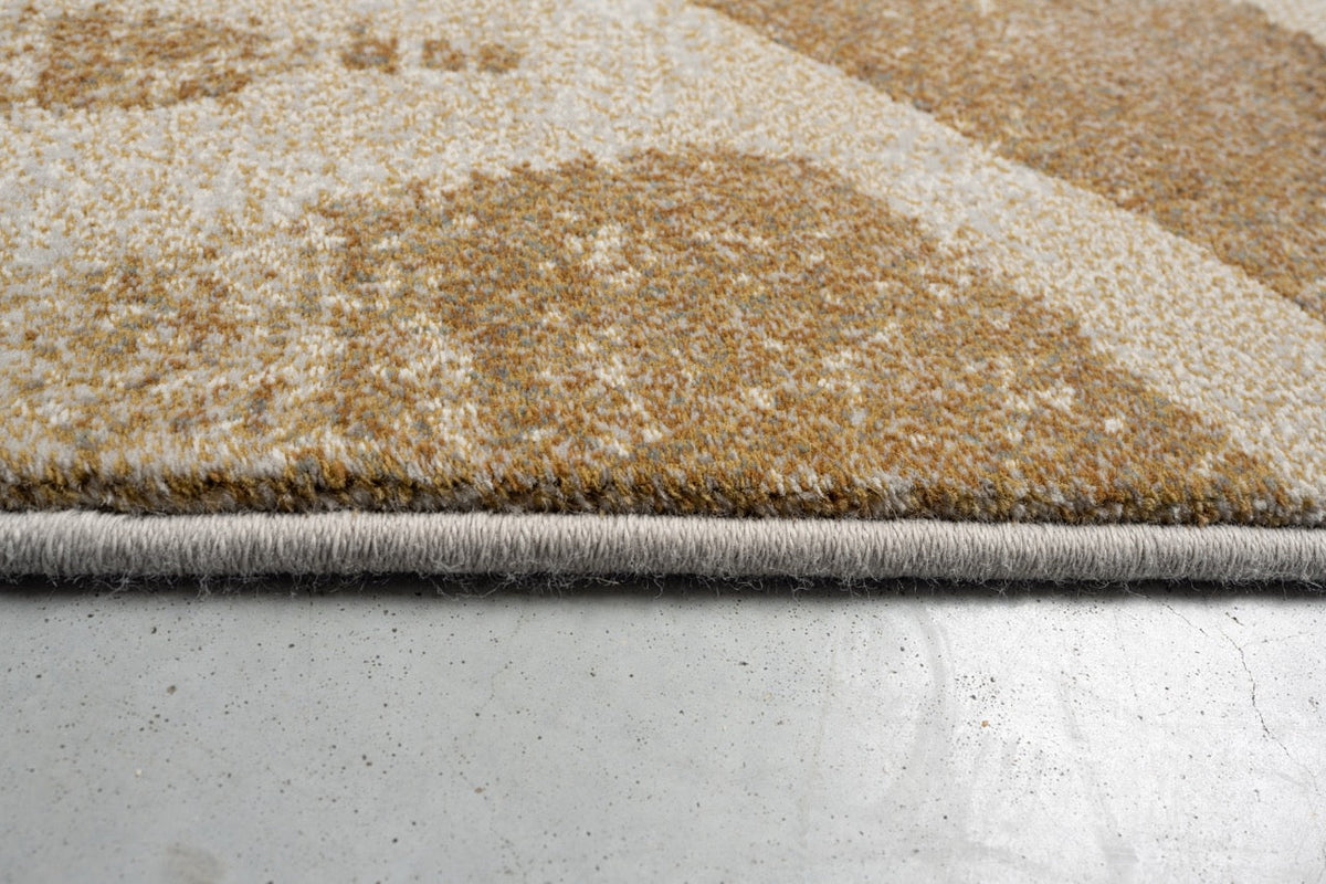 Side view of the low pile and finished edge of the Tapison Home Torino 063.0990.7299 rug
