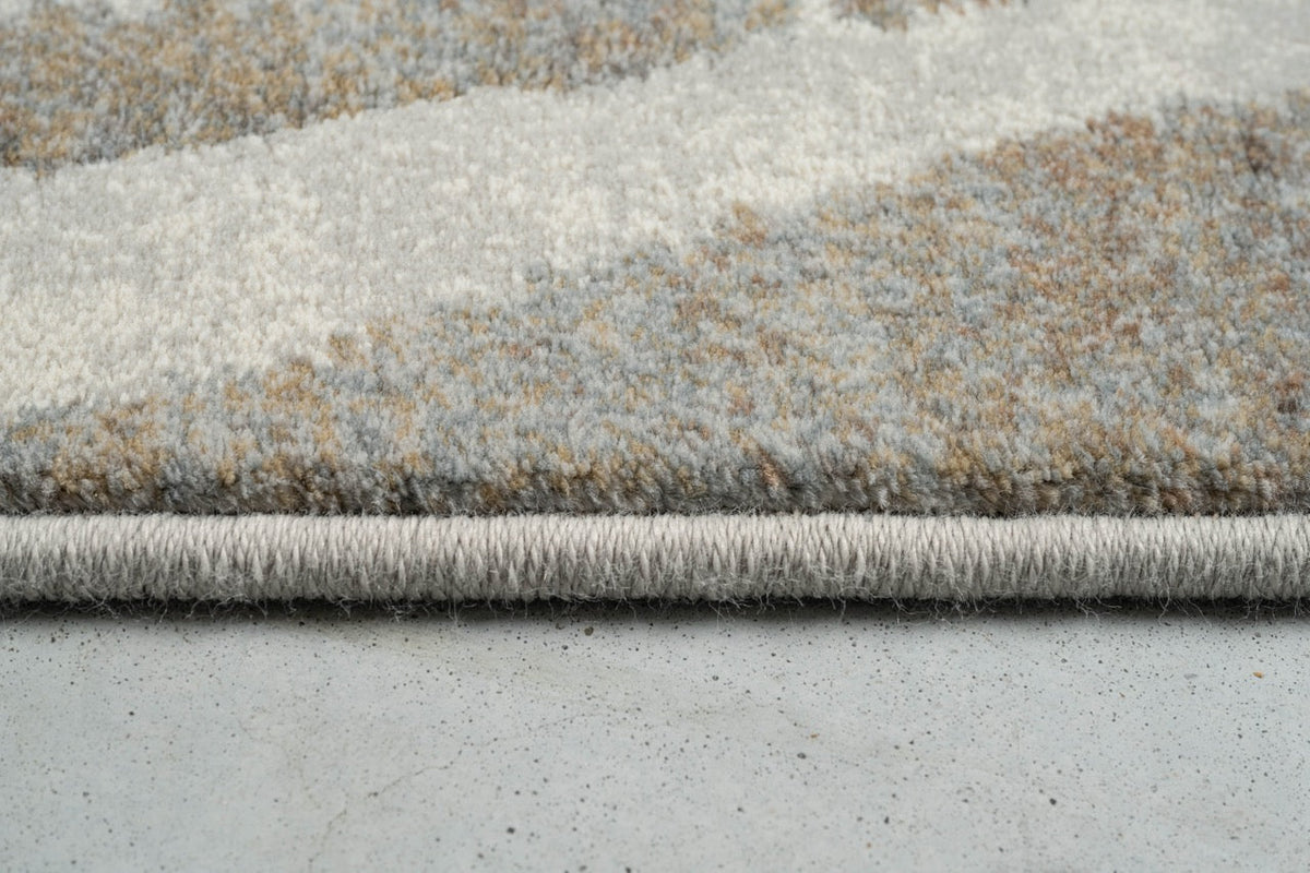 Side view of the low pile and finished edge of the Tapison Home Torino 063.0990.9243 rug