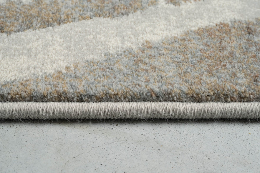 Side view of the low pile and finished edge of the Tapison Home Torino 063.0990.9243 rug