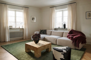 Olive Green Wool Rug, Layered Capulet Olive, in a living room
