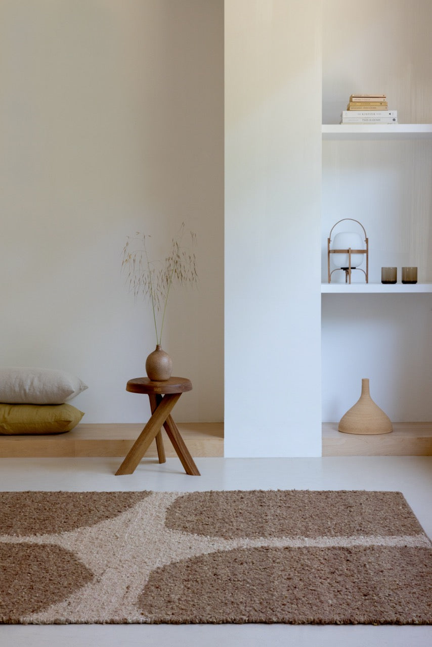 Brink & Campman Craft Fundament Caramel rug styled in a modern natural living room