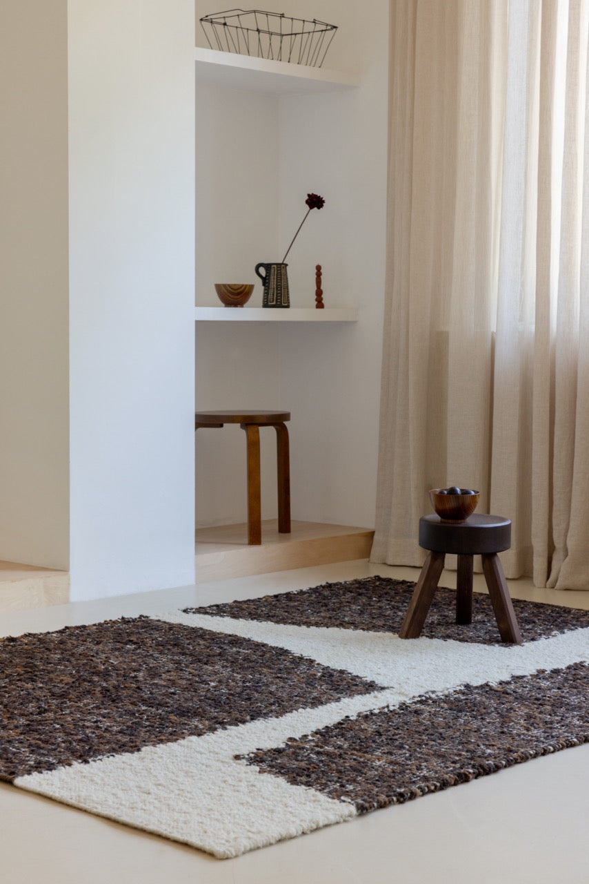 Brink & Campman Craft Fundament Chocolate Cream rug in warm-toned modern living room