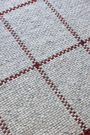 Close-up of matte wool texture and tonal grid design