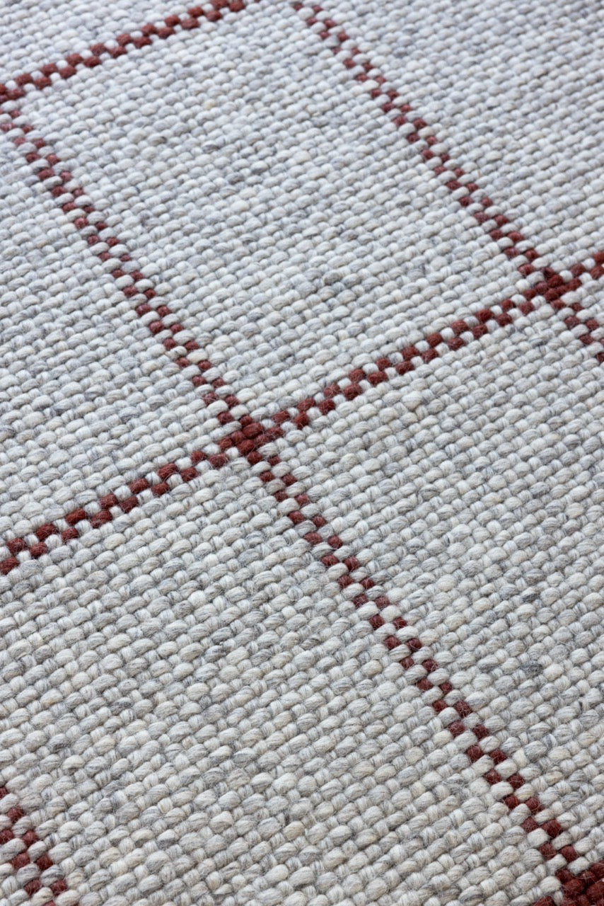 Close-up of matte wool texture and tonal grid design