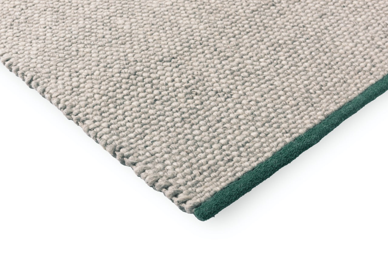 Detail shot of handwoven texture and tonal grey surface