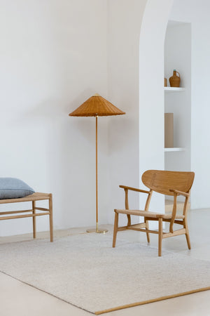 Brink & Campman Craft Matter Plain Warm White rug placed in sunlit living room