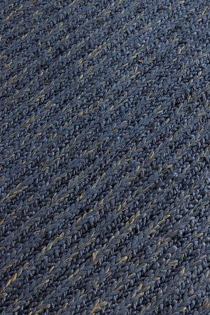 Close-up of braided denim wool texture in handwoven flatweave rug