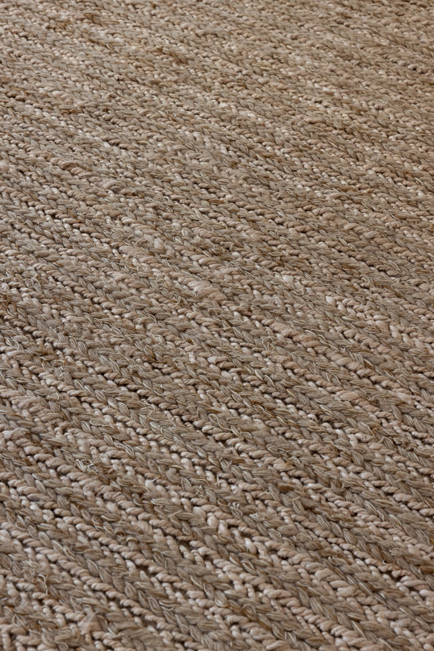 Close-up of braided plait texture in undyed wool flatweave rug