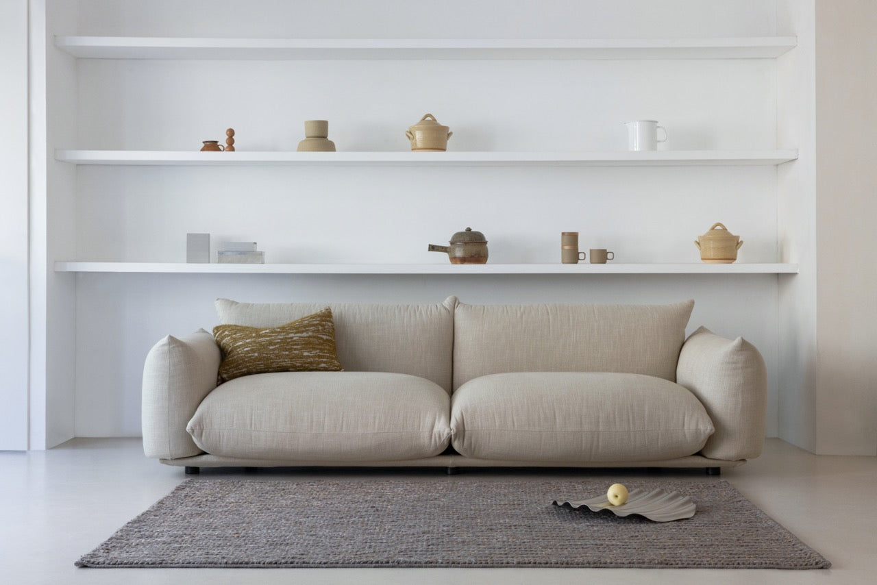 Brink & Campman Craft Plait Stone rug styled in a soft neutral living room