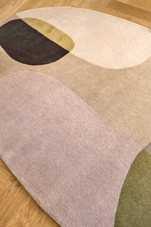 Brink & Campman Decor Miller Autumn rug in sand beige, blush pink and olive green, shown in an interior, third view