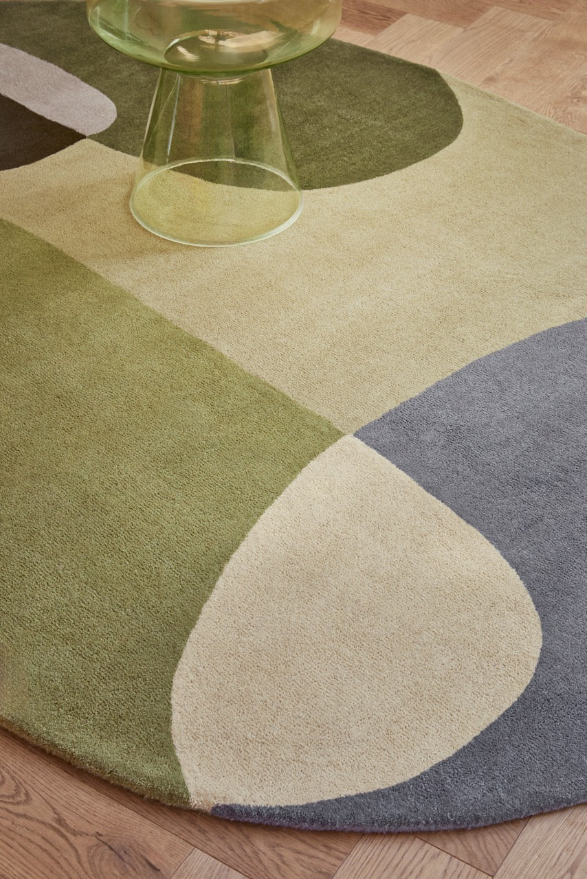 Brink & Campman Decor Miller Summer rug in sage green, forest green and dove grey, shown in an interior, second view
