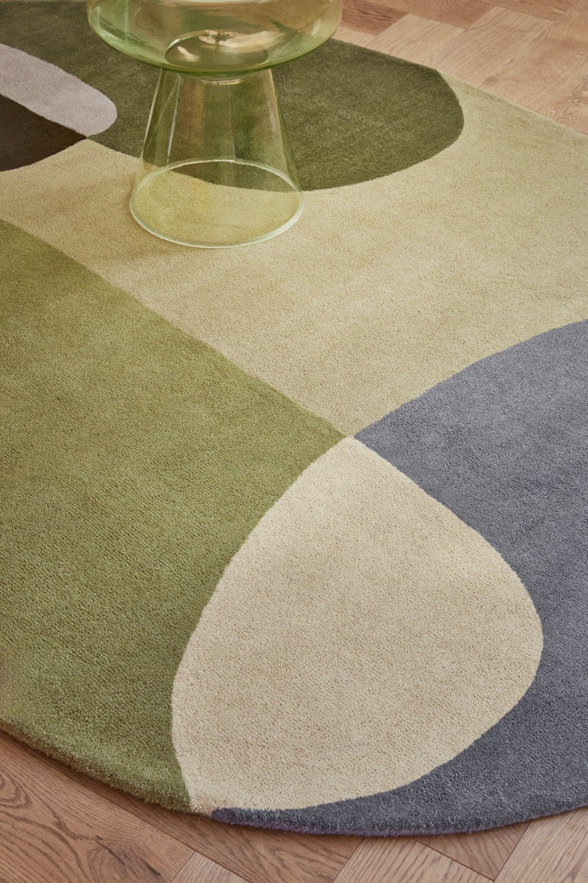 Brink & Campman Decor Miller Summer rug in sage green, forest green and dove grey, shown in an interior, second view
