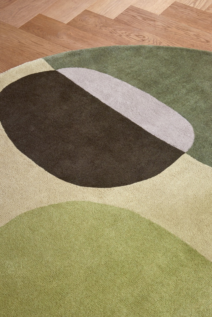 Brink & Campman Decor Miller Summer rug in sage green, forest green and dove grey, shown in an interior, third view