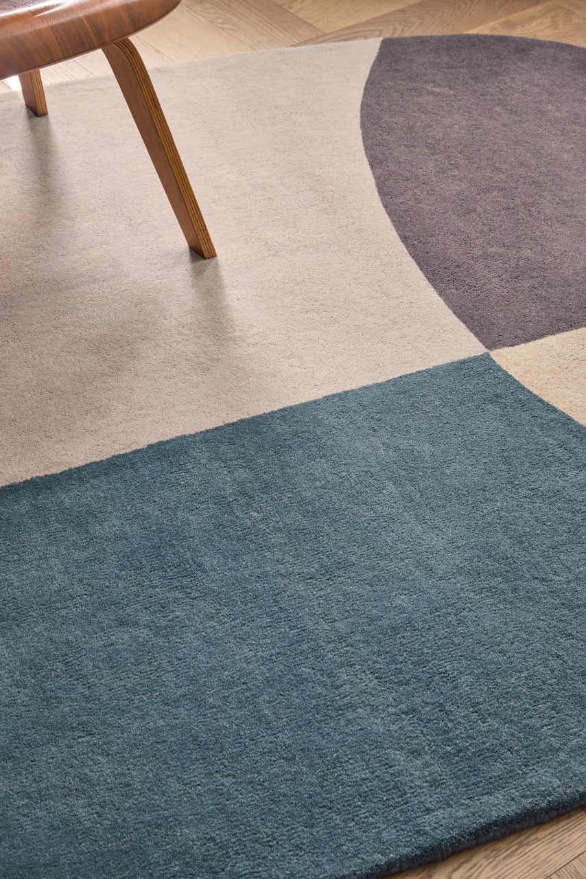 Brink & Campman Decor Miller Winter rug in petrol blue, blush beige and charcoal brown, shown in an interior, third view