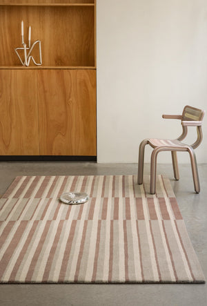 Brink & Campman Decor Pilar Blush rug in dusty pink with cream and greige stripes, shown in an interior
