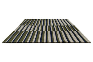 Brink & Campman Decor Pilar Moss rug in moss green with navy blue and light grey stripes, perspective view