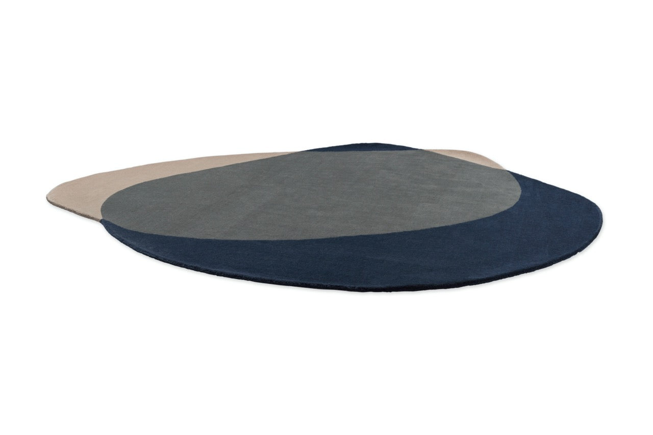  Brink & Campman geometric rug layered with neutral-toned seating
