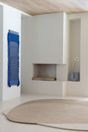  its sculpted surface features a series of softly carved abstract shapes — inspired by the fluid works of Jean Arp — that lend the rug subtle rhythm and sculptural expression.

The natural colourway combines ivory