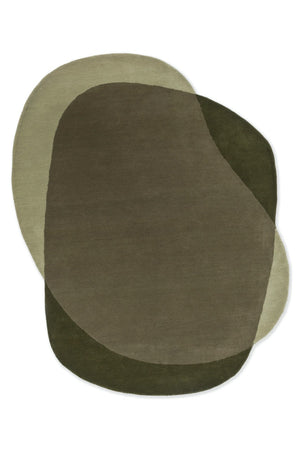 Abstract hand-tufted rug in forest and olive tones beneath oak coffee table