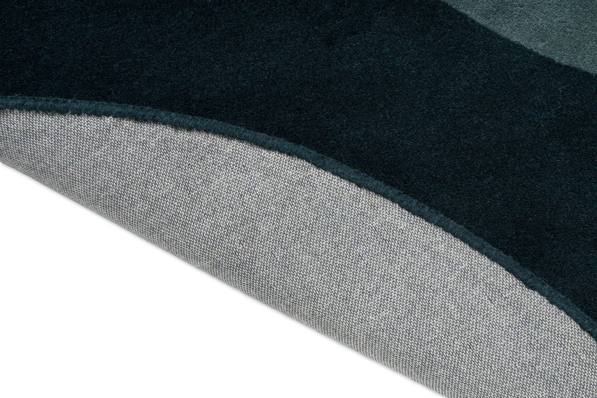 Brink & Campman Element Lane Blue rug, detail of folded edge and backing