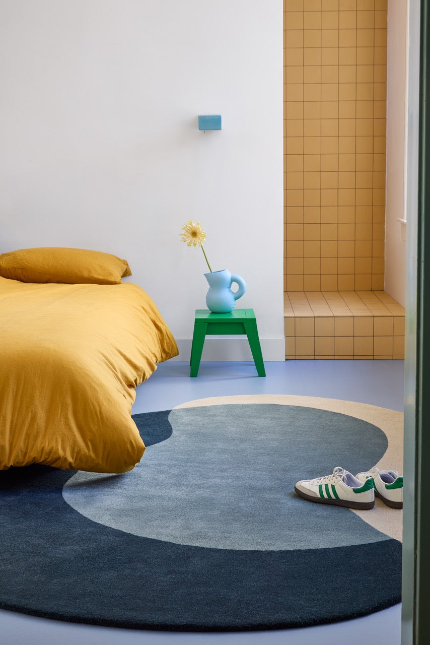Brink & Campman Element Lane Blue rug in midnight blue, slate blue and sand beige, shown in an interior