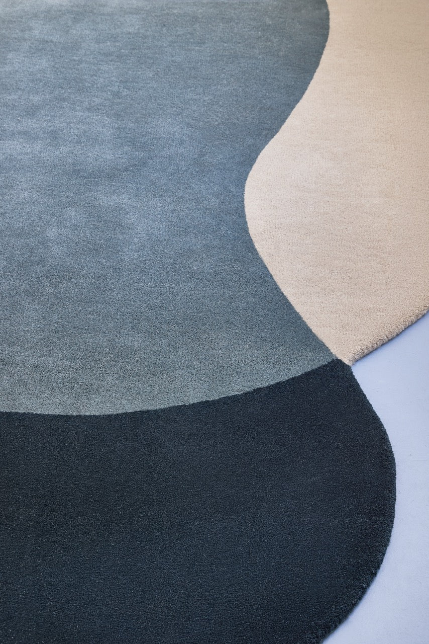 Brink & Campman Element Lane Blue rug in midnight blue, slate blue and sand beige, shown in an interior, third view