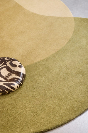Brink & Campman Element Lane Green rug in olive green, ochre yellow and cream, shown in an interior, second view
