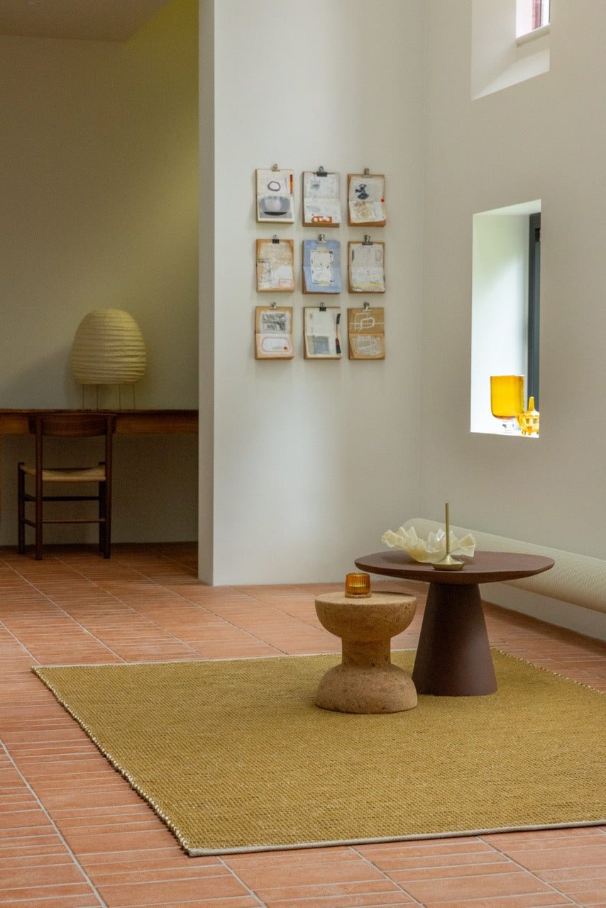Brink & Campman Frame Mustard rug styled in a modern oak and linen living room