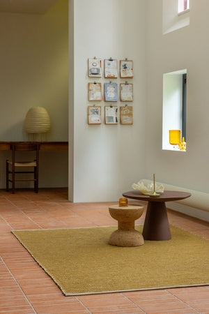 Brink & Campman Frame Mustard rug styled in a modern oak and linen living room