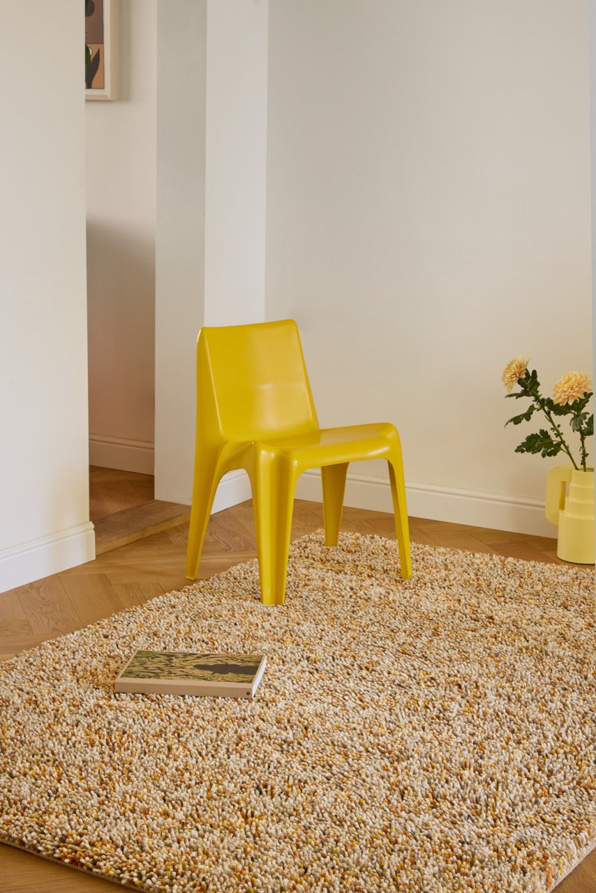 Brink & Campman Loom Calendula rug in marigold yellow, ochre and cream, shown in an interior