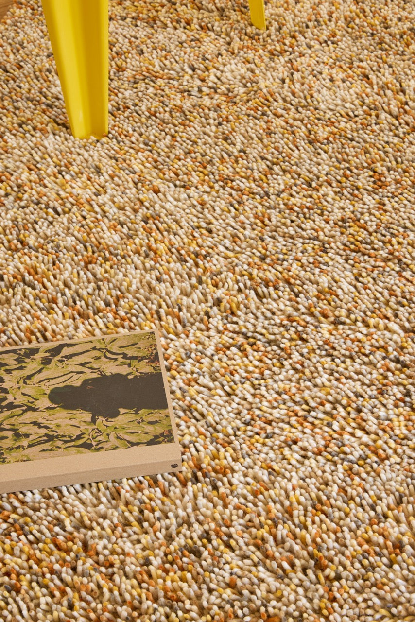 Brink & Campman Loom Calendula rug in marigold yellow, ochre and cream, shown in an interior, second view