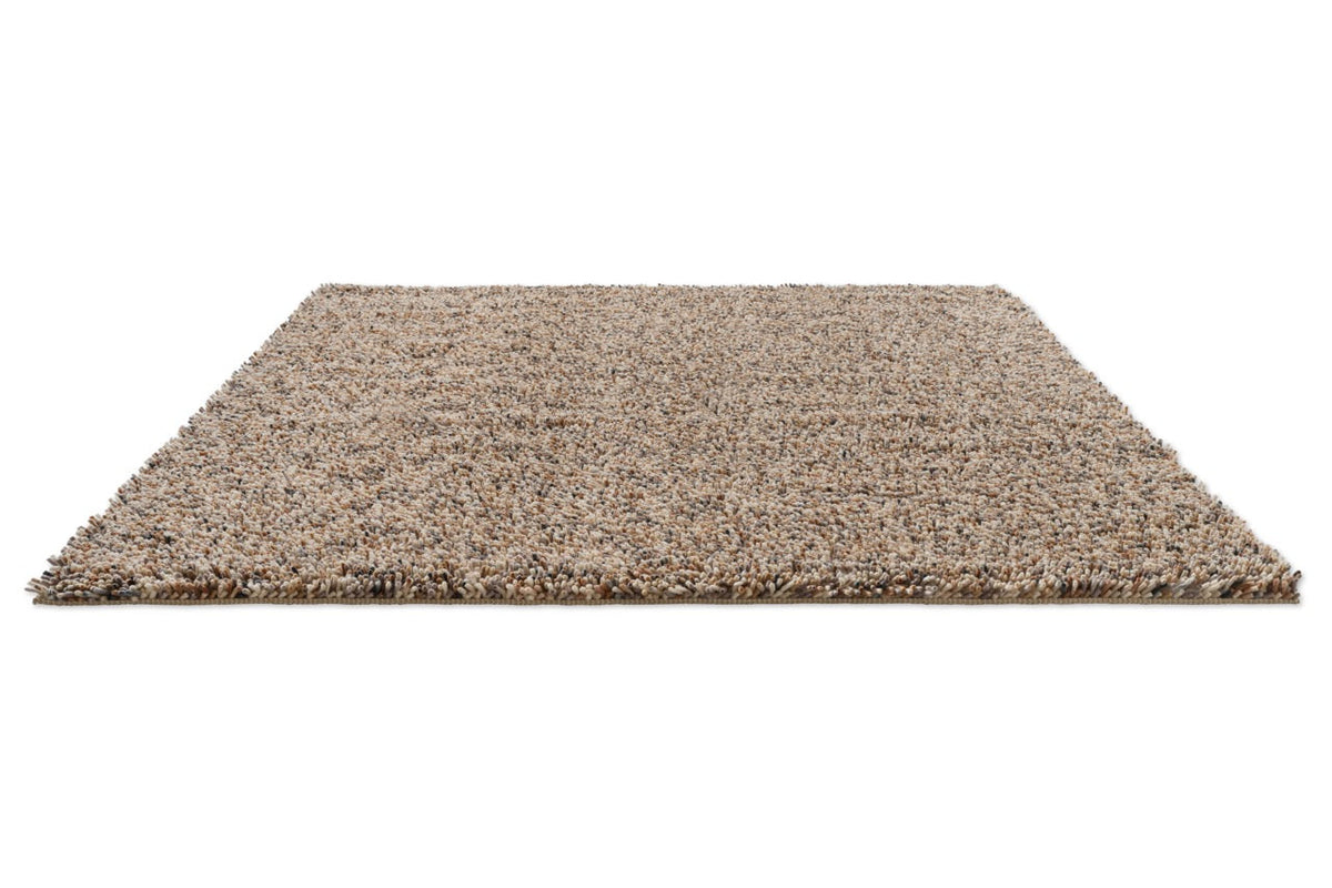 Brink & Campman Loom Natural rug in beige and cream with grey and charcoal flecks, perspective view