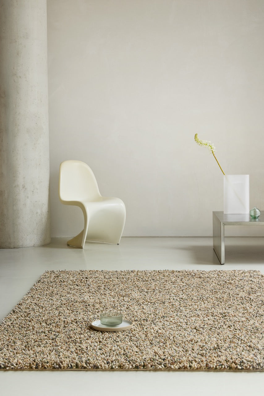 Brink & Campman Loom Natural Moss rug in beige and cream with moss green and brown flecks, shown in an interior