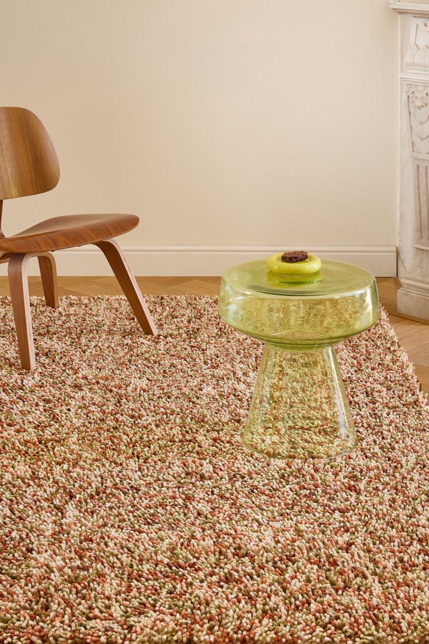 Brink & Campman Loom Pumpkin rug in pumpkin orange, coral and olive green, shown in an interior