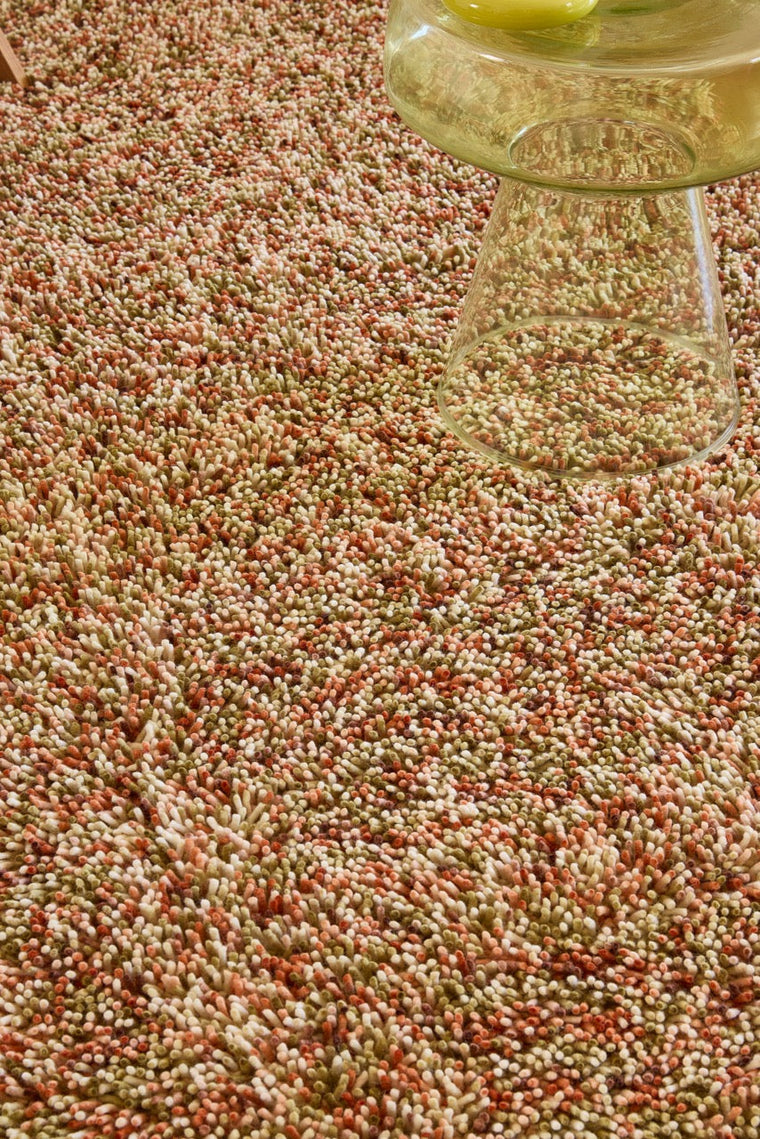 Brink & Campman Loom Pumpkin rug in pumpkin orange, coral and olive green, shown in an interior, second view