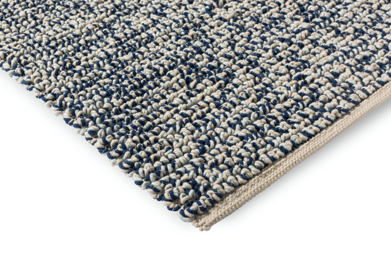 Corner view of Nest Ink rug showing pile thickness and sculptural weave


