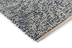 Corner view of Nest Ink rug showing pile thickness and sculptural weave

