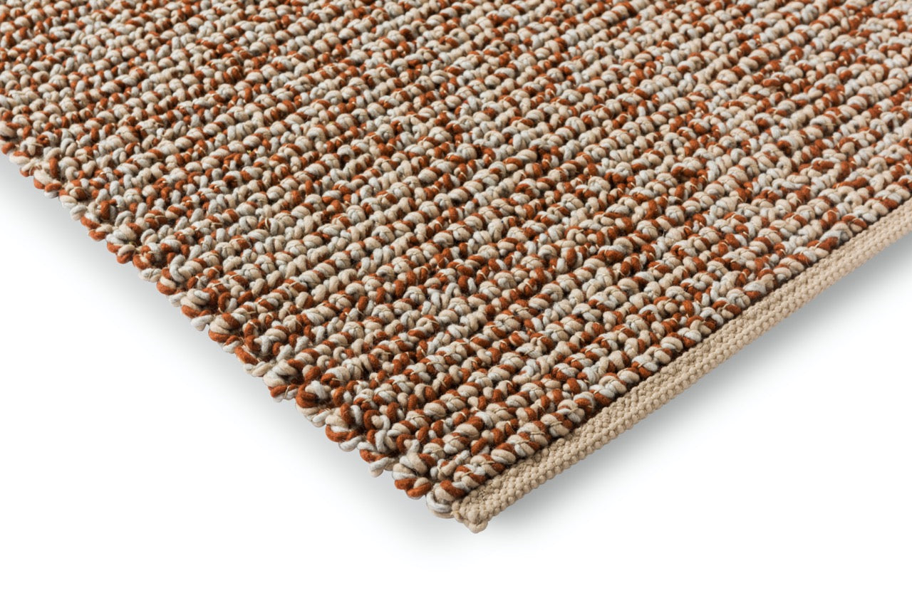 Close-up of the handwoven wool texture showcasing the rich leather hue and intricate weave.