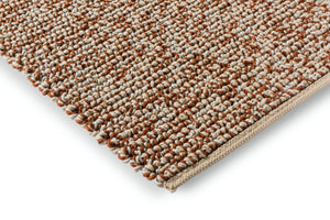 Close-up of the handwoven wool texture showcasing the rich leather hue and intricate weave.