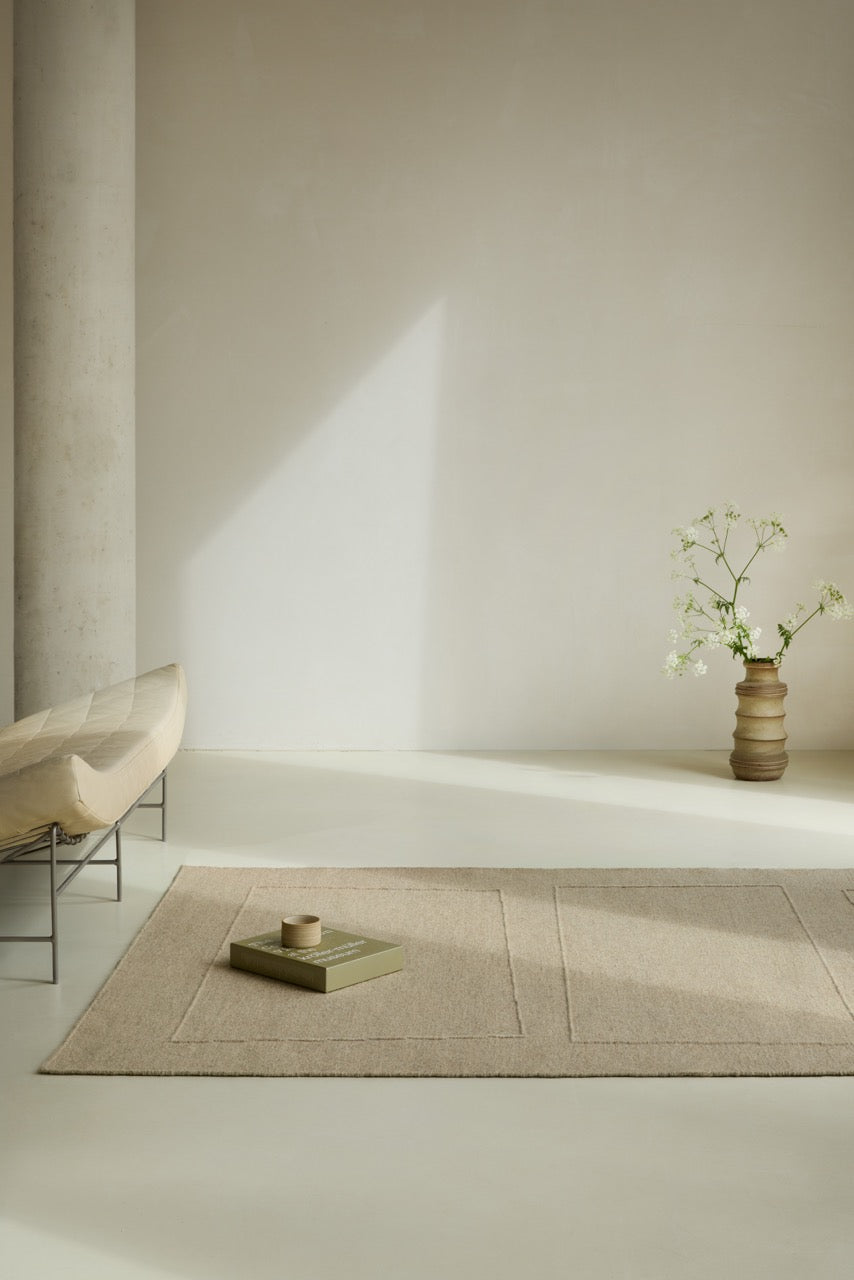 Brink & Campman Senso Blocks Natural rug in sand beige with three blocks in relief, shown in an interior