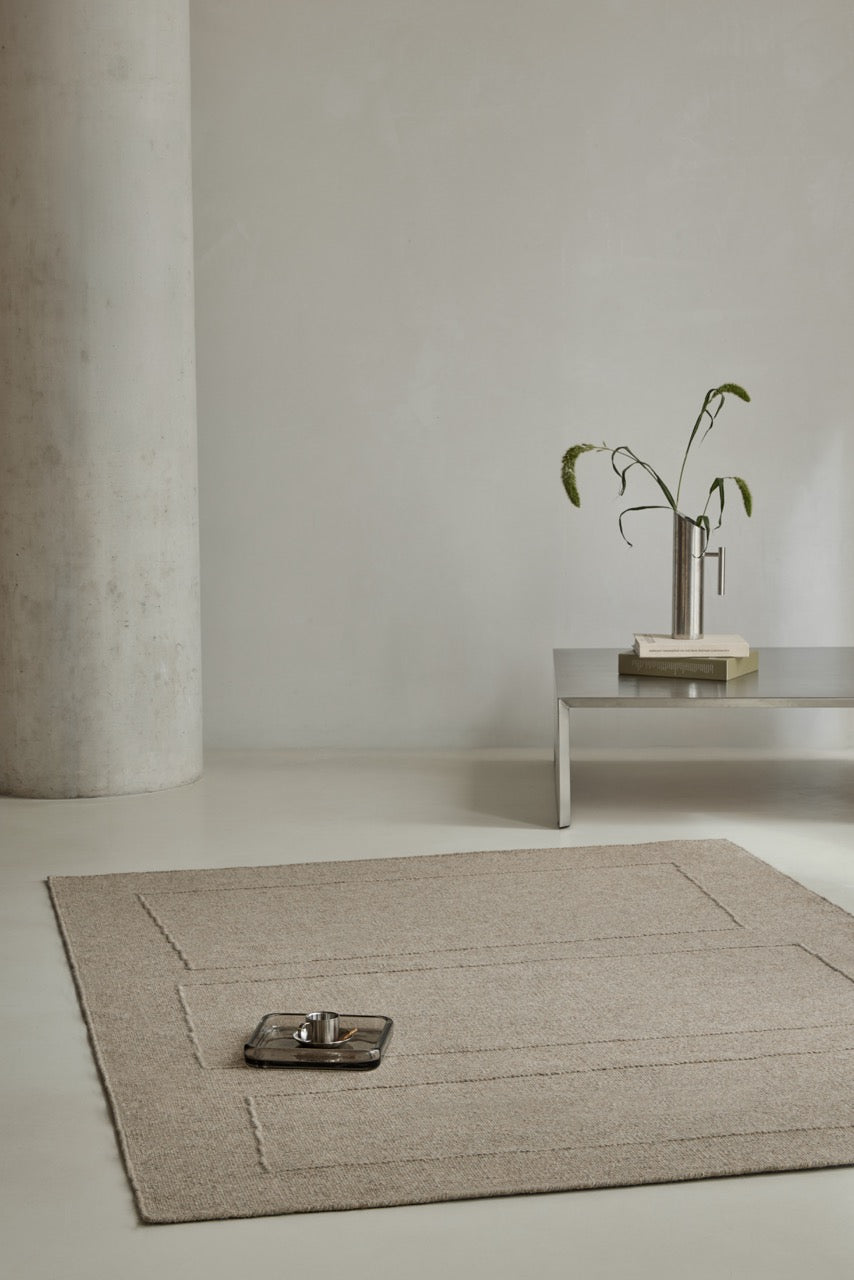 Brink & Campman Senso Blocks Soft Taupe rug in grey taupe with three blocks in relief, shown in an interior