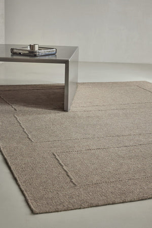 Brink & Campman Senso Blocks Soft Taupe rug in grey taupe with three blocks in relief, shown in an interior, second view