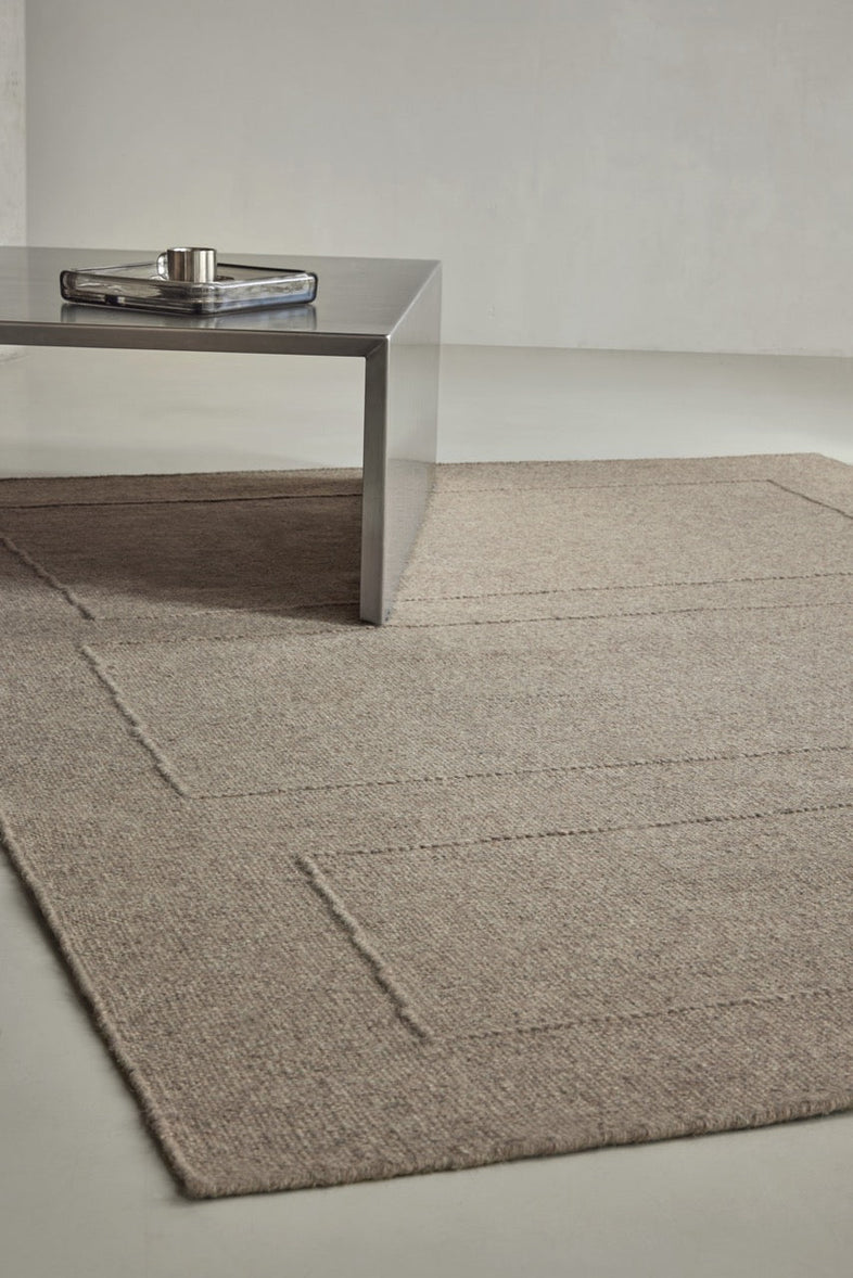 Brink & Campman Senso Blocks Soft Taupe rug in grey taupe with three blocks in relief, shown in an interior, second view